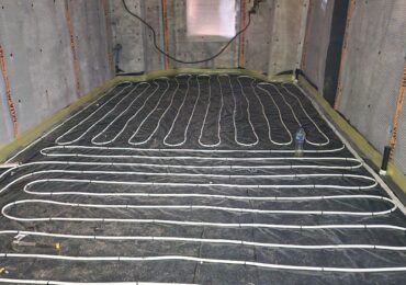 Underfloor heating pipes laid in a residential floor installation