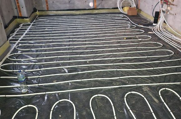 Underfloor heating pipes laid in a residential floor installation