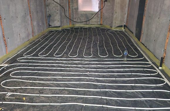 Underfloor heating pipes laid in a residential floor installation
